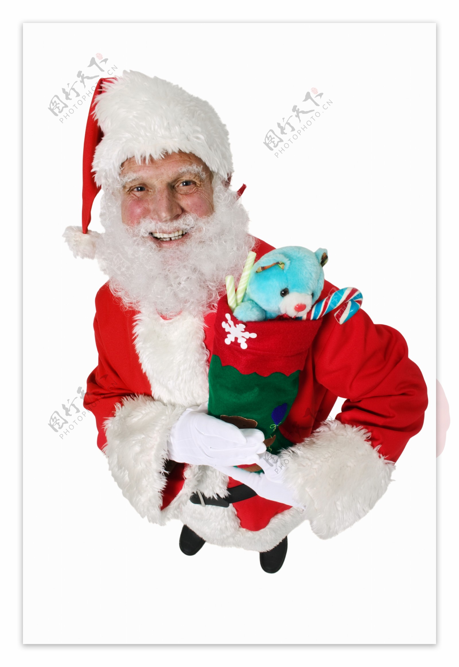 抱着玩具熊慈祥的圣诞老人图片